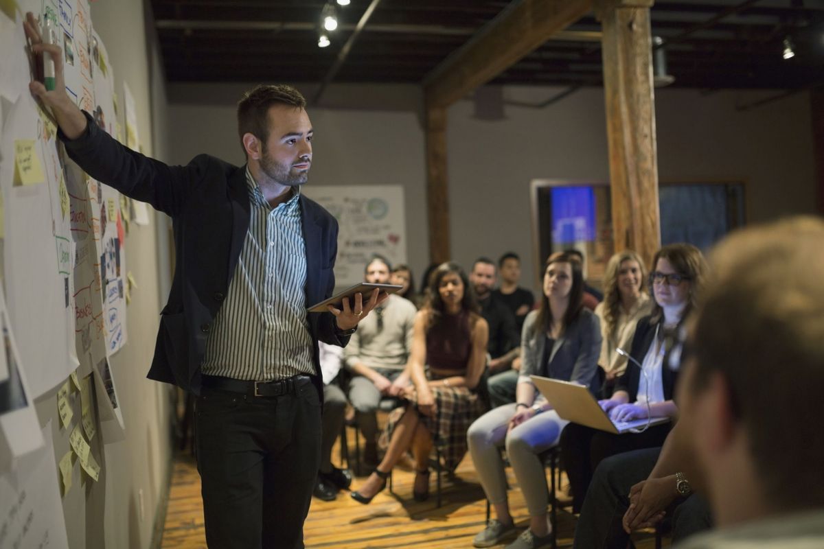 Growing company office with people collaborating